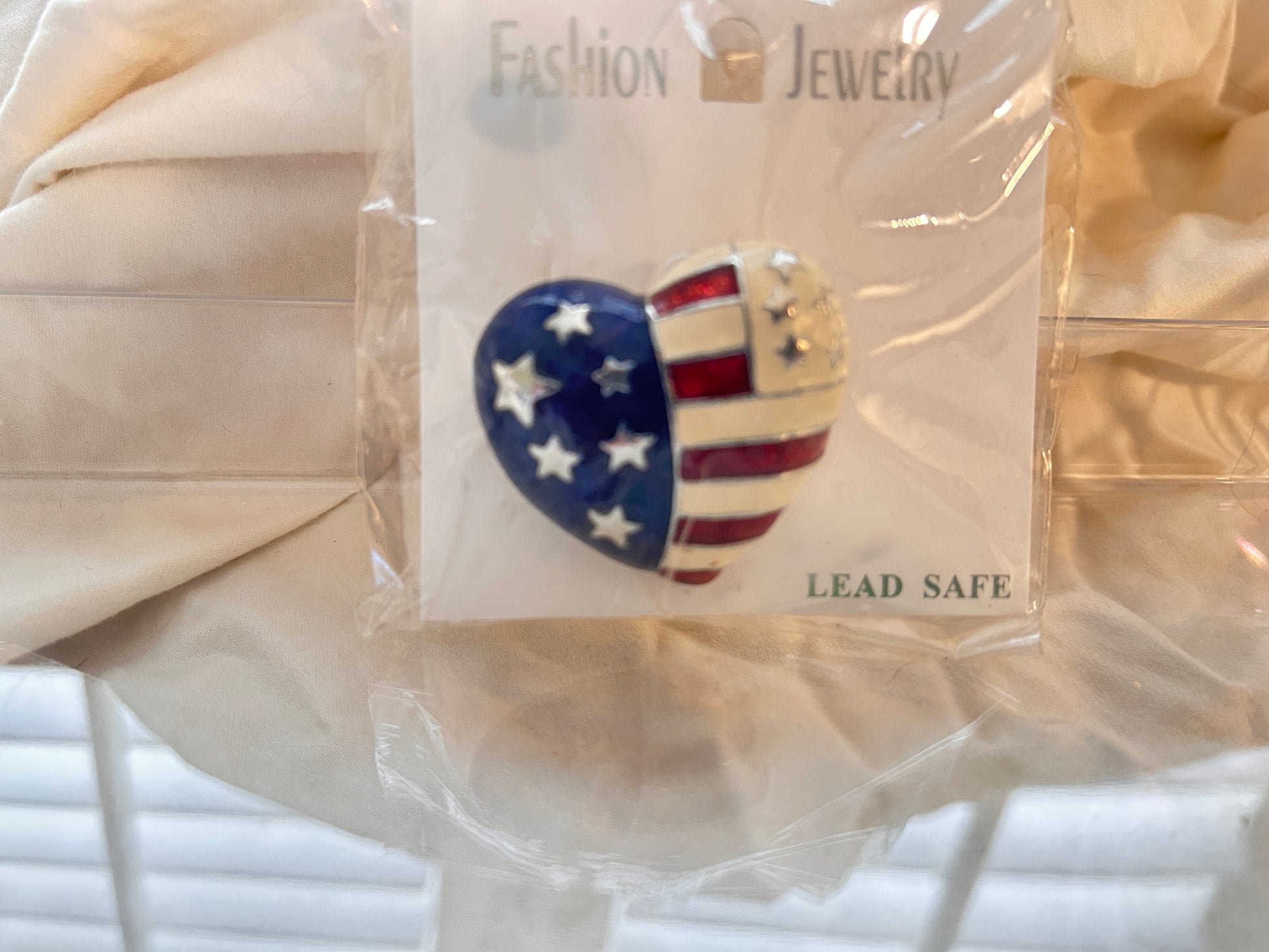 Patriotic Heart Pin Brooch eye catching glossy enamel finish. A creative twist on   the Stars and Stripes.
Red White and Blue split down the middle in a lovely heart shape.
Perfect for Memorial day July 4, Labor Day, Veterans Day.
For lapels, scarves, hats, denim jacket, or a tote bag!