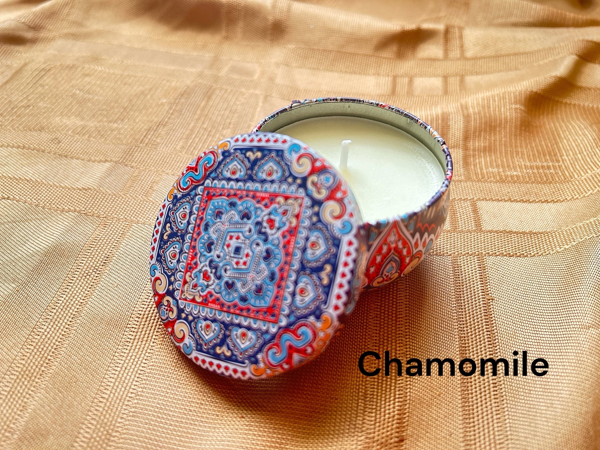 Chamomile scented mosaic candle encassed in a stunning vibrant tin. It blends striking visual artistry with a premium fragrance experience! 