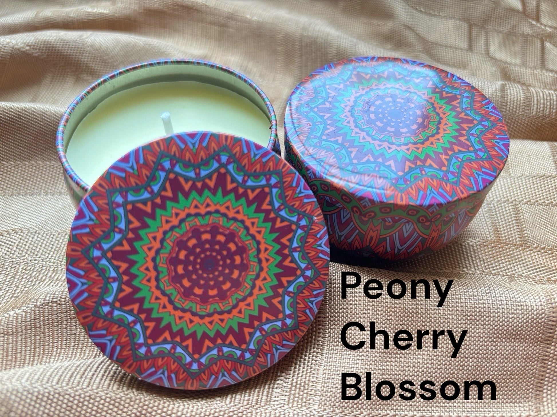 Cherry blossom scented mosaic candle encassed in a stunning vibrant tin. It blends striking visual artistry with a premium fragrance experience! 